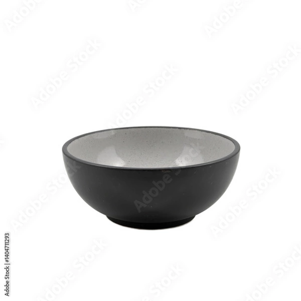 Fototapeta A sleek black ceramic bowl with a subtle speckled interior, perfect for serving small dishes or as a decorative piece.