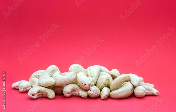 Obraz Closeup of Cashew Nut Stack Isolated on Red Background with Copy Space