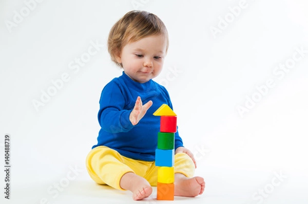 Obraz Little child playing with dices isolated on white background