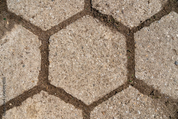Fototapeta Old hexagonal concrete cubes on the road, as texture.