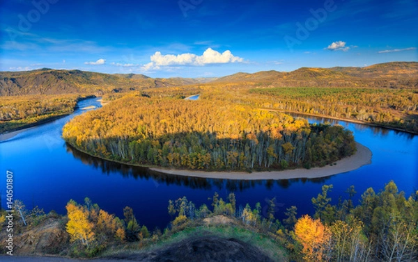 Fototapeta Bairu Island in the middle of winding river, color of autumn in northeast China
