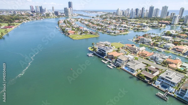 Fototapeta Aerial view with Macintosh island waterfront properties to the right, and surrounds.facing north with Surfers Paradise in the horizon.
