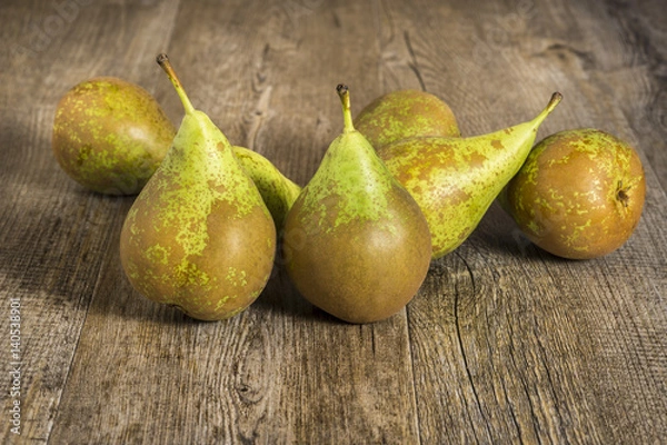 Fototapeta Conference pears on rustic wood