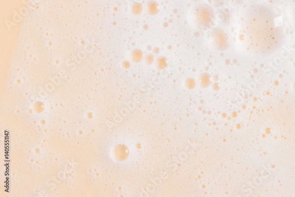 Obraz Abstract yellow orange color clean soapy foam texture. Shampoo foam with bubbles background
