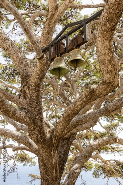 Fototapeta Tree with two bells at church at Monastery of St. John the Theologian, known as Monastery of Preveli (rebuilt in 1878). Crete, Greece.