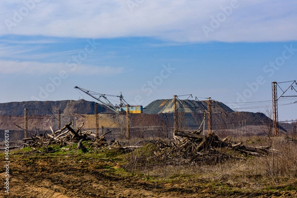 Fototapeta View on slag heaps of the iron ore quarry and heavy excavator