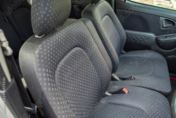 Fototapeta The modern interior of the car is equipped with comfortable front seats and headrests with good velour upholstery, which ensures a comfortable ride.
