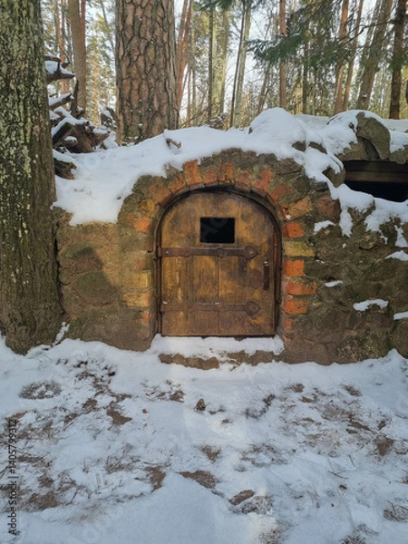 Obraz Tiny dwarf village hidden in the forest. Snow covered elf houses. Whimsical travel place. Closed front door