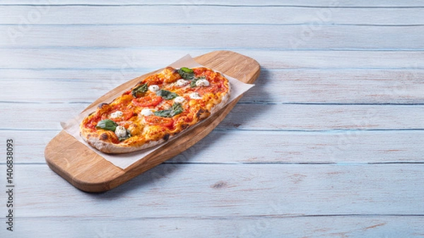 Obraz Classic Margherita pizza with a thin, crispy crust, rich tomato sauce, melted mozzarella, and fresh basil leaves. Served on a rustic wooden board with a warm, textured background, emphasizing its