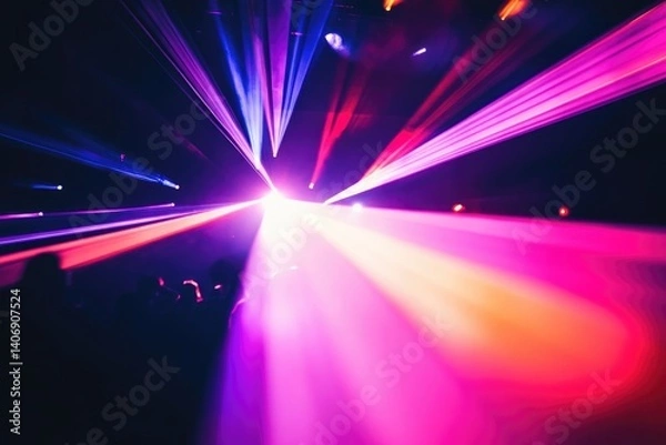 Obraz Vibrant laser beams illuminate a dark concert venue, creating a mesmerizing spectacle for the audience.