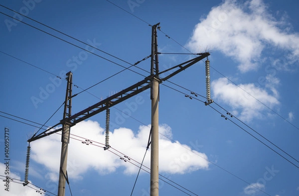 Obraz Poles with high voltage wires against the blue sky