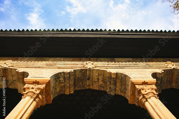 Fototapeta View of historical building under cloudy sky, Traditional roof with blue sky and clouds, Vintage architecture, Ancient building under a cloudy blue sky, historical building, Persia, Persian, Iran