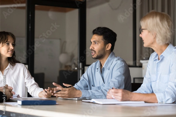 Fototapeta Business professional man, strong leader leading board meeting, executive people talk in a boardroom. Manager discussing project with diverse partner team. Office management working, finding solutions