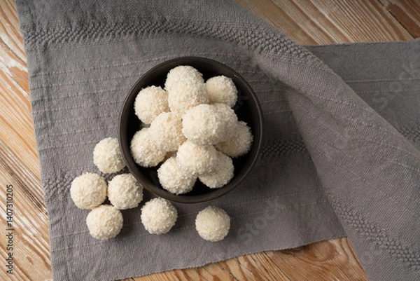 Obraz Coconut candies pile, coco ball. White truffle ball, indian ladoo or laddu with sweet cream and coco