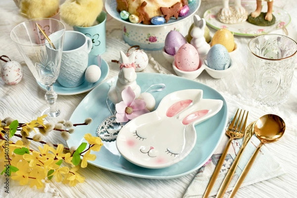 Obraz Easter table setting with blue plate and bunny shaped small plate and decors