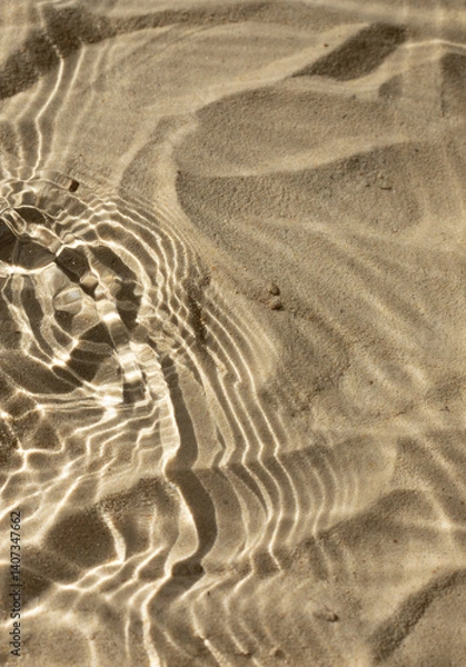 Obraz Water texture with shadows on sea beach sand