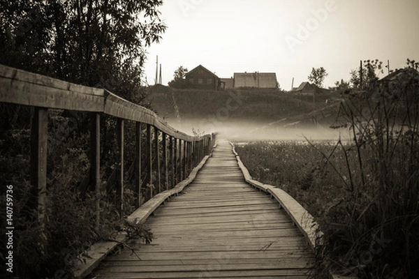 Obraz Old wooden bridge to village hill. Vintage gothic rustic black and white photo