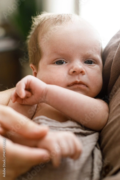 Fototapeta Little newborn baby close up in mothers hands. Happy Mothers day! Motherhood and parenthood. Adoption and fertility concept