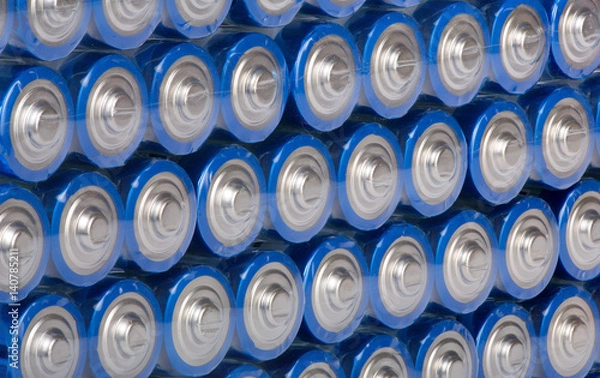 Fototapeta background from rows of blue batteries