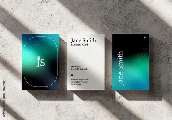 Fototapeta Set of Vertical Business Card Mockups on Concrete Wall with Shadows