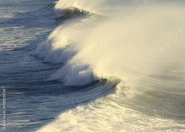 Fototapeta Close-up of a stormy wave with wind-blown spray or spindrift.