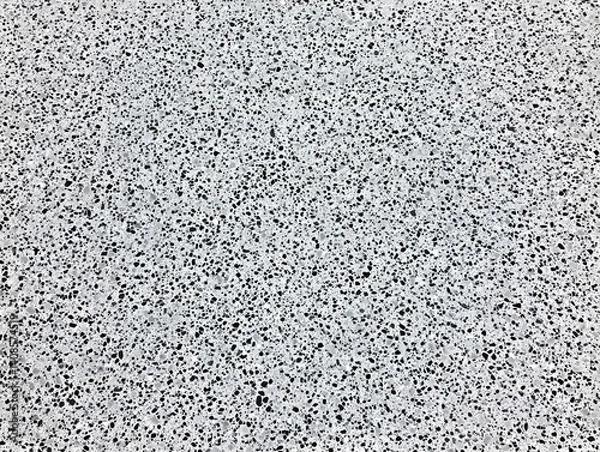 Fototapeta Grey speckled texture background, small stone, aggregate, pebble, surface