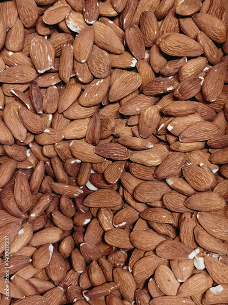 Obraz Background of large peeled almonds, randomly arranged top view