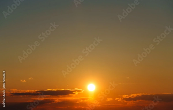 Fototapeta beautiful and dramatic sunset sky with bright yellow clouds as abstract background