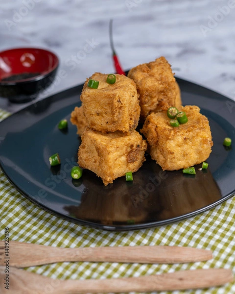 Obraz Crispy Brown Fried Tofu That Looks Crunchy And Savory With A Colorful Background Looks Very Appetizing.