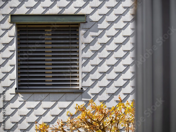 Obraz Modern Building Facade with Geometric Tile Pattern