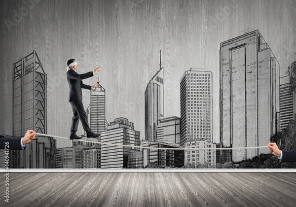 Fototapeta Business concept of risk support and assistance with man balancing on rope