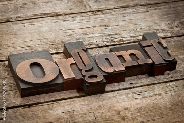 Obraz organic, word written with vintage letterpress printing blocks, angled view, rustic wooden background