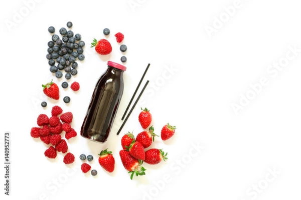 Fototapeta Bottle of strawberries, raspberries, blueberries juice isolated on white.