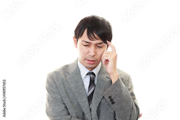 Fototapeta 頭痛に悩む男性
