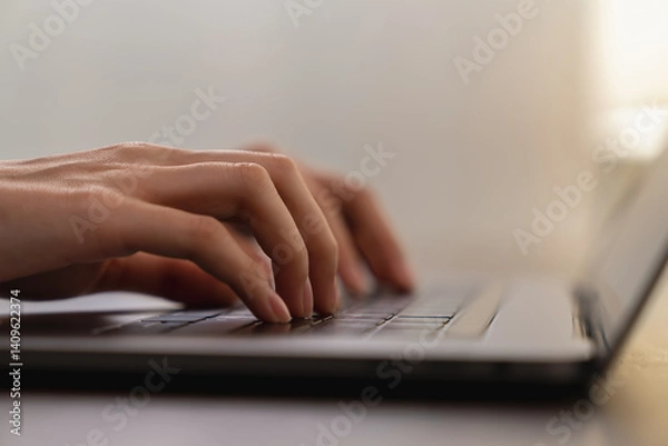 Fototapeta Hands typing keyboard on laptop with working online.