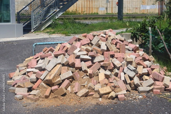 Obraz A pile of broken bricks on a city street, urbanism, 2