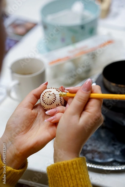 Obraz The process of painting Easter eggs, using bees wax as traditional Lithuanian method