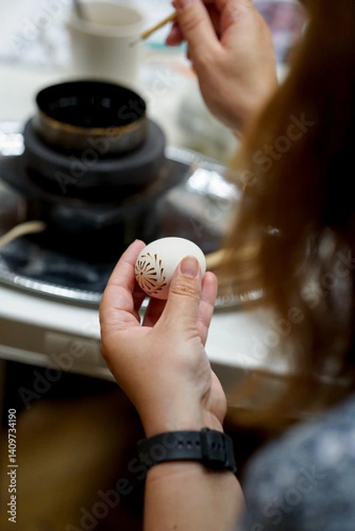 Obraz The process of painting Easter eggs, using bees wax as traditional Lithuanian method
