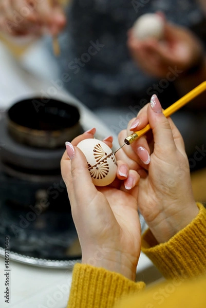 Obraz The process of painting Easter eggs, using bees wax as traditional Lithuanian method