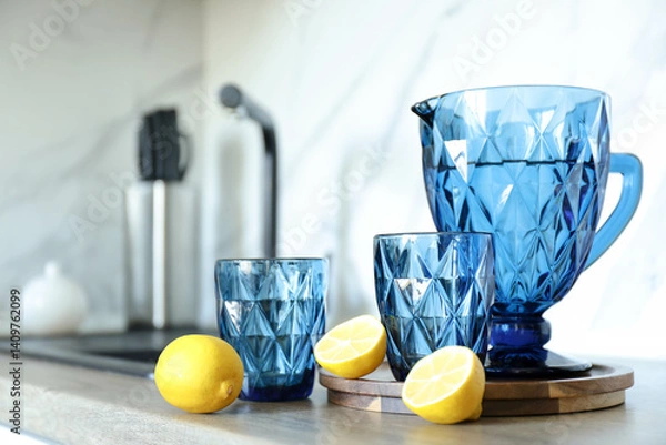 Obraz Blue faceted jug and glasses filled with water