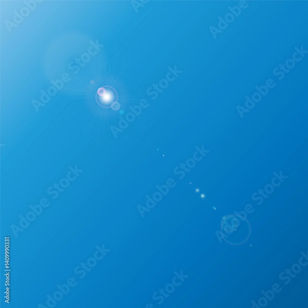 Fototapeta The sun, located at the top of a clear blue sky, emits a bright light, creating a lens flare effect with soft rays directed downwards.