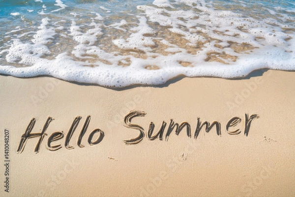 Fototapeta Text "Hello Summer" written in beach sand with ocean waves.
