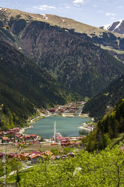 Obraz A small village between a beautiful lake