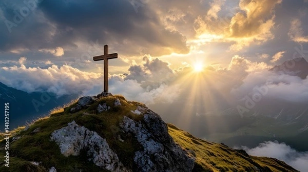 Fototapeta crucifix at the top of a mountain with sunlight breaking through the clouds inspirational christian image