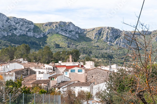 Obraz a view of a village with mountains in the background .La vall de gallinera, Alicante, Spain