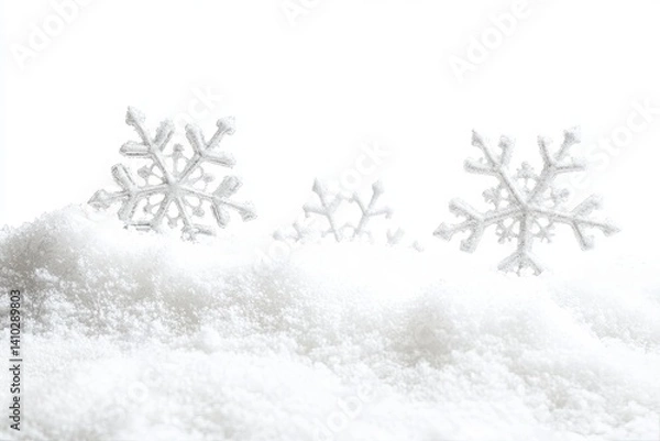 Fototapeta Snowflakes on a snowy drift. Soft, light, wintery scene. Background is a clean, bright white