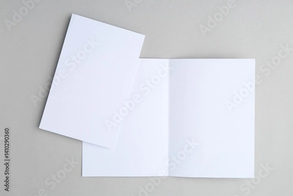 Fototapeta Blank greeting cards on light background, top view