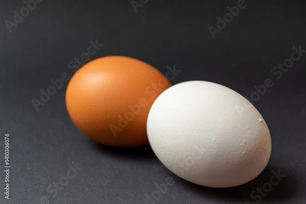 Obraz Brown and white egg - black background