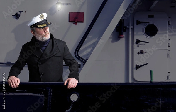 Obraz Kapitän steht an der Reeling eines Schiffes