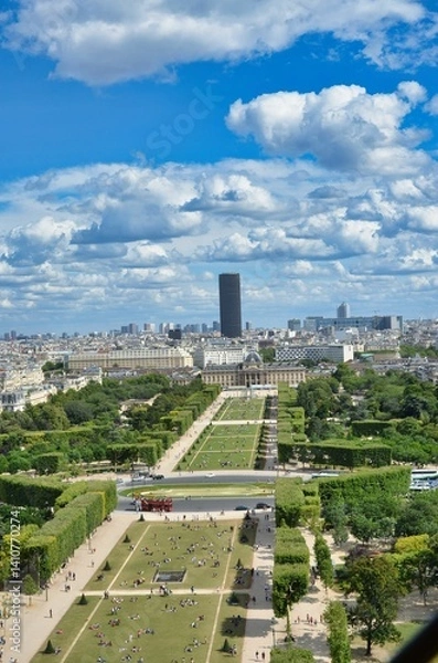 Fototapeta The Champ de Mars is a public garden in Paris located on the Left Bank. It is bordered to the northwest by the Eiffel Tower and to the southeast by the École Militaire.